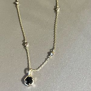 Kendra Scott gold necklace with black drusy stone